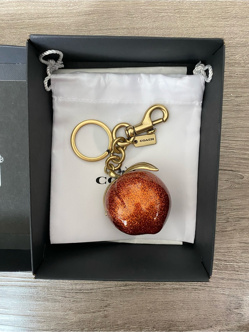Coach The Summer I Turned Pretty Peach Keychain Charm